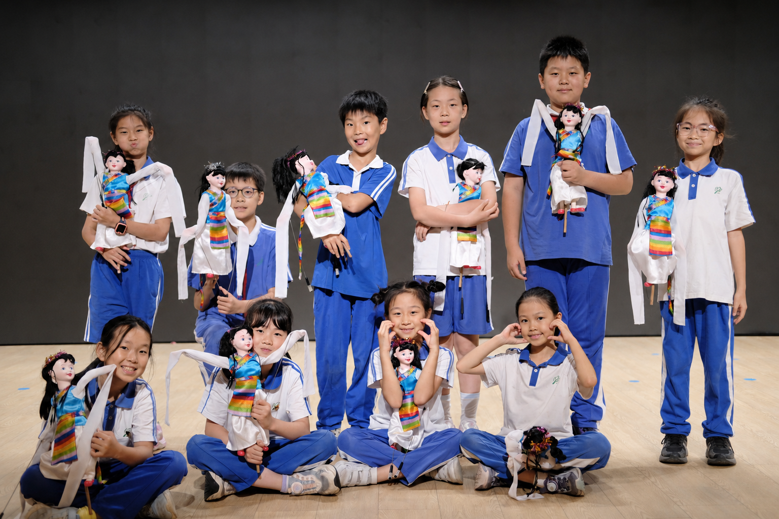 Lixiang School Puppet Club students performing with puppets
